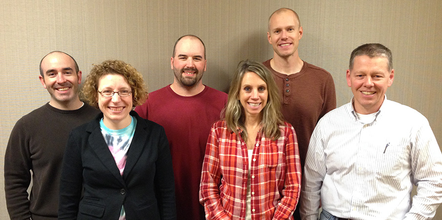 Landscape Structures custom process flow team pose for a group photo.